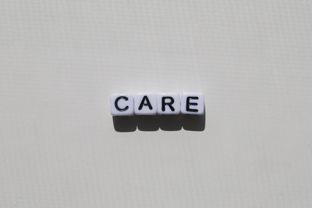 Word CARE in bubes on white background.の写真素材