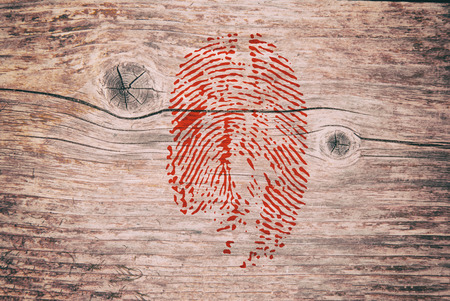 Blood Fingerprint image on the wooden background. Crime murder Texture.の写真素材