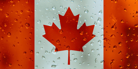 Flag of Canada on a water drops background. Canadian Flags waterdrop texture.の写真素材
