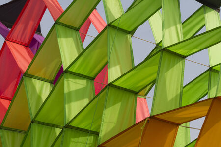 colorful kites flying in the skyの写真素材