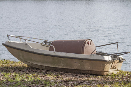 abandoned boat on lake