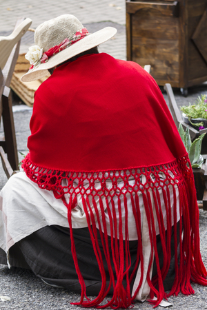 woman with red shawlの写真素材