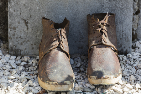 old boots in the streetの写真素材