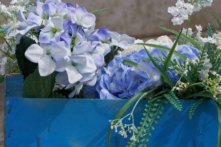ornamental fabric flower in the blue boxの写真素材