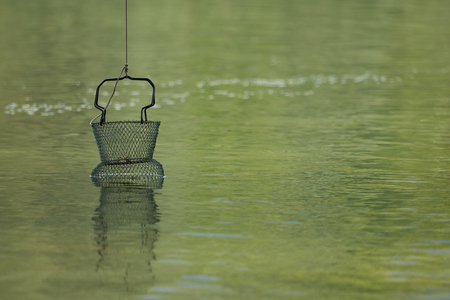 fisherman's basket at lakeの写真素材