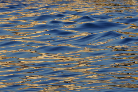 reflection  wave on water at lakeの写真素材