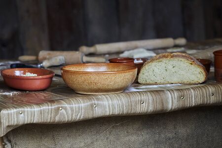 bread and bowls on the tableの写真素材