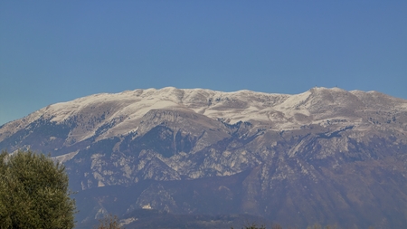 snowy mountains and blue skyの写真素材