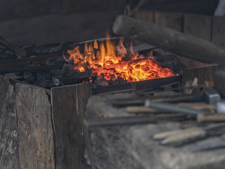 blacksmith works red hot ironの写真素材