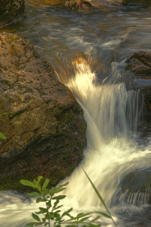 river, waterfall and rockの写真素材