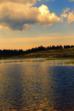 landscape of sunset on lake in the mountainの写真素材