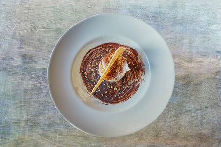 dessert with waffle, chocolate and hazelnutsの写真素材