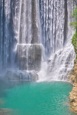 scenic waterfalls in the mountainの写真素材