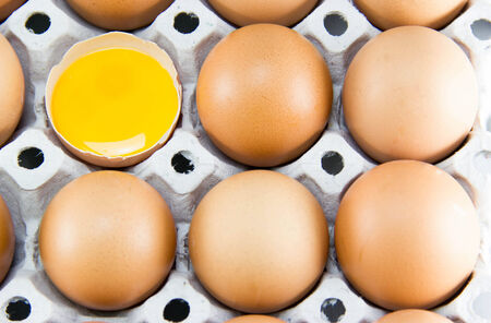 Brown eggs in detail on a tray.