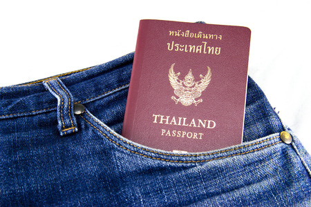 Thai passports in jean pocket.の写真素材