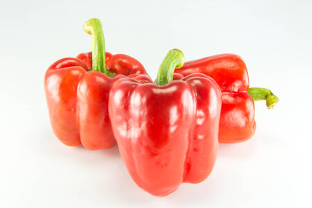 Fresh colorful sweet bell peppers  ( capsicum ) on a white background.の写真素材