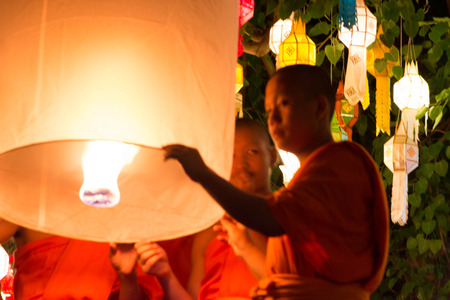 CHIANG MAI THAILAND-NOVEMBER 7 : Loy Krathong festival in Chiangmai.Tradition al monk lights floating balloon made of paper annually at Wat Phan Tao temple.On November 7,2014 in Chiangmai,Thailand.のeditorial素材