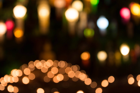 Abstract festive background with bokeh defocused lightsの写真素材