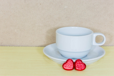 Still life cup of coffee on wooden table over grunge background, Valentine concept.の写真素材