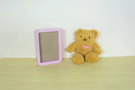 Still life with bear on wooden table over grunge background, Valentine concept.の写真素材