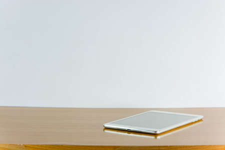 Still life tablet and smart phone on wooden table