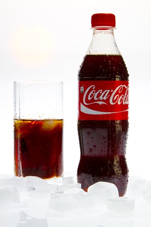 Coca Cola with glass and ice on white background Coca Cola with glass and ice on white background