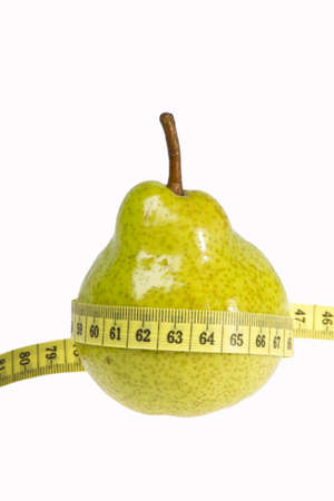 Pear with measuring tape islolated on white backgroundの写真素材
