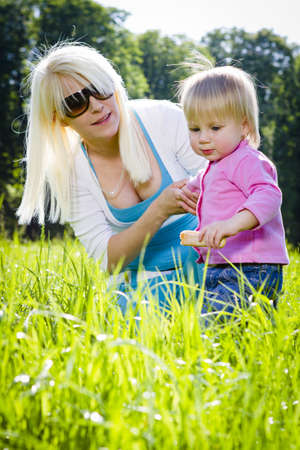 Young mothers in the park playing with childrenの写真素材