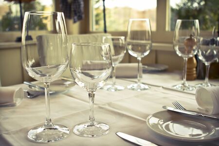 Table in the restaurant prepared for guestsの写真素材