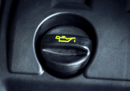 Oil cap on the engine cover with yellow logo