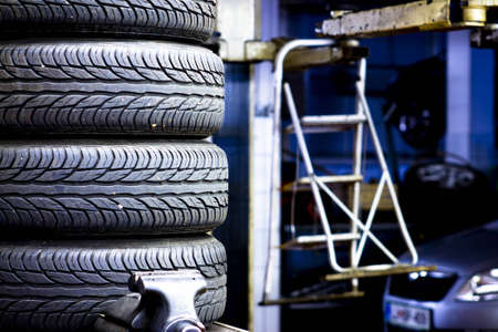 Stacked car tires at the mechanic shopの写真素材