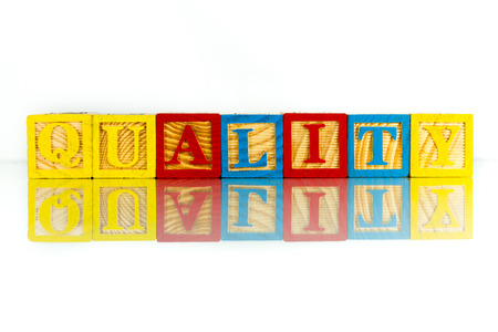 quality word reflection on white backgroundの写真素材