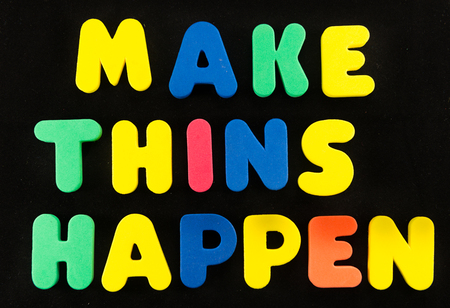 make things happen word in black backgroundの写真素材