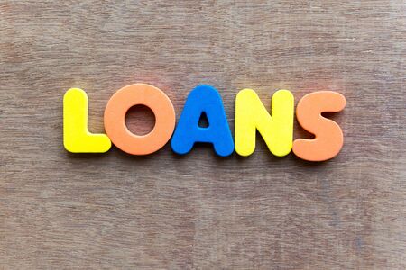 loans colorful word in the wooden backgroundの写真素材