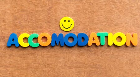 accomodation colorful word on the wooden backgroundの写真素材