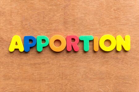 apportion colorful word on the wooden backgroundの写真素材