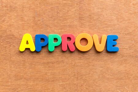 approve colorful word on the wooden backgroundの写真素材