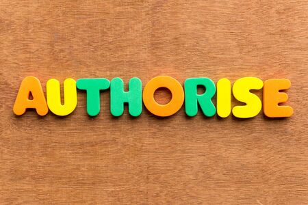 authorise colorful word on the wooden backgroundの写真素材