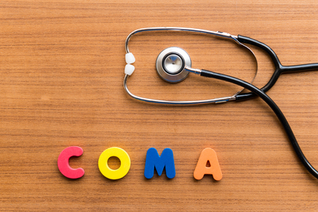 COMA colorful word on the wooden backgroundの写真素材
