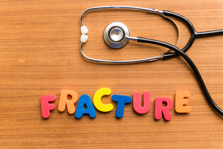 fracture colorful word on the wooden backgroundの写真素材