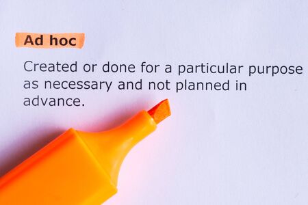 ad hoc word highlighted on the white paperの写真素材