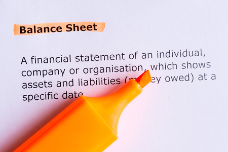 balance sheet   word highlighted  on the white paperの写真素材