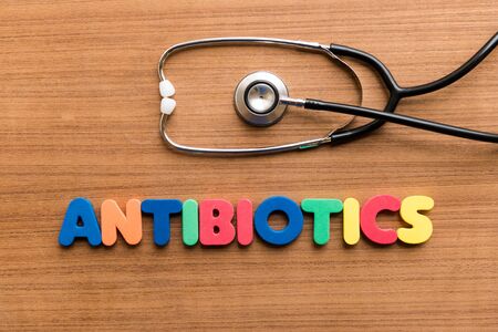 Antibiotics  colorful word with Stethoscope on wooden backgroundの写真素材