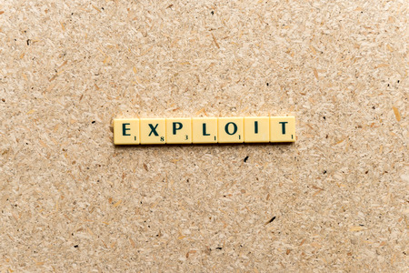exploit  word on the simple  wooden backgroundの写真素材