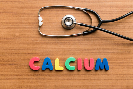 Calcium   colorful word with Stethoscope on wooden backgroundの写真素材