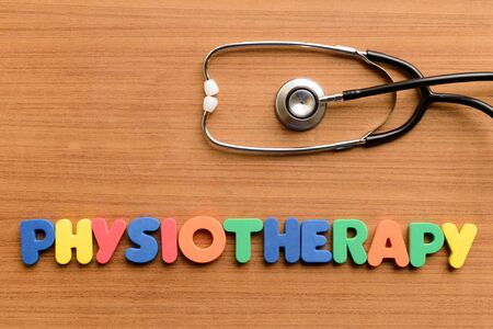 Physiotherapy  colorful word on the wooden backgroundの写真素材