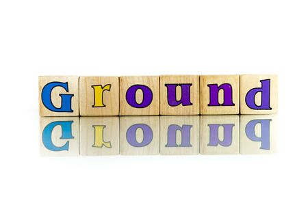 ground colorful wooden word block on the white backgroundの写真素材