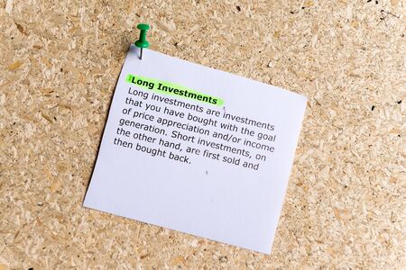 long investments word typed on a paper and pinned to a cork notice boardの写真素材