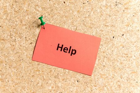 help word typed on a paper and pinned to a cork notice boardの写真素材