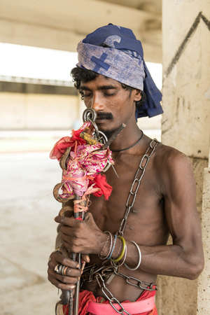 Dhaka, Bangladesh - July 19, 2014: chains around  a eyes shutdown man at Dhaka, Bangladeshのeditorial素材